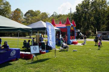 Tents, vendors, and families gathered on the lawn at the Rec Jam festival.